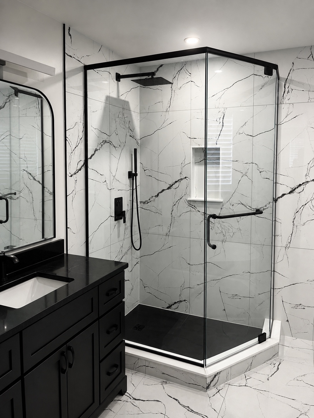 Marble-look shower with glass enclosure