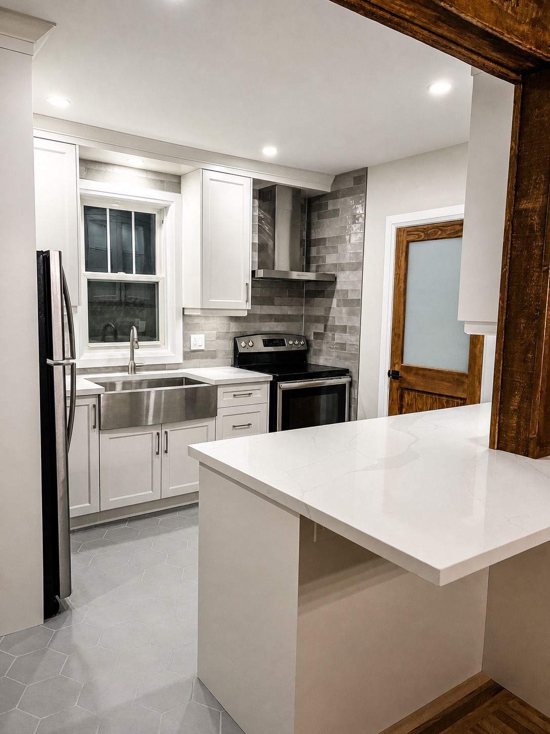 White kitchen cabinetry and farmhouse sink